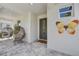 Charming front porch featuring stylish seating, a welcome mat, and a decorative butterfly at 7458 Gathering Dr, Kissimmee, FL 34747