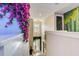 Upstairs hallway with floral decor, leading to a themed room, creating a whimsical transition at 7458 Gathering Dr, Kissimmee, FL 34747