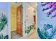 Hallway decorated with custom botanical accents and featuring decorative doors at 7458 Gathering Dr, Kissimmee, FL 34747