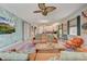 Open concept living room with stylish furnishings and wallpaper detail at 7458 Gathering Dr, Kissimmee, FL 34747