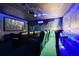Home theater with reclining seats, starry ceiling, and jungle-themed wall murals, perfect for movie nights at 7458 Gathering Dr, Kissimmee, FL 34747