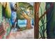 Bedroom with a treehouse theme, complete with a faux tree, mural and special details at 7458 Gathering Dr, Kissimmee, FL 34747
