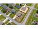 An aerial view of a single Gathering home on a corner lot in a residential neighborhood at 761 Parrot Ct, Kissimmee, FL 34759