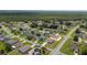 Aerial neighborhood view shows homes with landscaping and paved roads around them at 761 Parrot Ct, Kissimmee, FL 34759