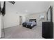 Bedroom features plush carpet, natural lighting, television, and coordinating furniture at 761 Parrot Ct, Kissimmee, FL 34759