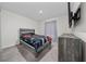 Bedroom with carpet, a TV, neutral paint, and a rustic wood dresser at 761 Parrot Ct, Kissimmee, FL 34759