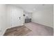 Inviting entryway with neutral paint, wood flooring and new carpet at 761 Parrot Ct, Kissimmee, FL 34759