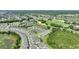 Aerial view of community close to a golf course, emphasizing community living and natural surroundings at 7834 Stoney Bay Loop, Kissimmee, FL 34747