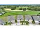 Aerial view of homes showcasing the community, landscaping, and proximity to the golf course at 7834 Stoney Bay Loop, Kissimmee, FL 34747