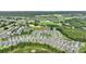 Aerial view of the neighborhood with golf course and lush green landscaping at 7834 Stoney Bay Loop, Kissimmee, FL 34747