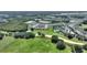 Aerial view showcases proximity to a golf course, emphasizing the community's recreational opportunities and scenic location at 7834 Stoney Bay Loop, Kissimmee, FL 34747