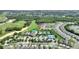 Aerial view of the community, golf course, and community amenities including pool and tennis courts at 7834 Stoney Bay Loop, Kissimmee, FL 34747