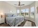 Comfortable bedroom with a view from the window and hardwood floors at 7834 Stoney Bay Loop, Kissimmee, FL 34747