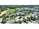 Lovely community center with tropical landscaping, featuring a large pool, amenities, and ample parking at 7834 Stoney Bay Loop, Kissimmee, FL 34747