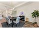 Well-lit dining room featuring elegant chandelier and stylish decor at 7834 Stoney Bay Loop, Kissimmee, FL 34747