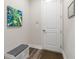 Welcoming entryway featuring a storage bench, stylish decor, and a clean, modern aesthetic at 7834 Stoney Bay Loop, Kissimmee, FL 34747