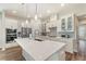 Spacious kitchen with a large island, modern appliances, and ample cabinet space for storage at 7834 Stoney Bay Loop, Kissimmee, FL 34747