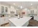 Bright kitchen featuring a large island, modern appliances, and white cabinets for a clean look at 7834 Stoney Bay Loop, Kissimmee, FL 34747