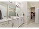 Luxurious main bathroom with double vanity, marble countertops, and walk-in closet at 7834 Stoney Bay Loop, Kissimmee, FL 34747
