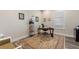 Comfortable home office with a classic desk, area rug, and great natural lighting at 7834 Stoney Bay Loop, Kissimmee, FL 34747