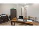 Office space featuring a wooden desk, storage cabinet, and modern decor at 7834 Stoney Bay Loop, Kissimmee, FL 34747