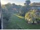 Exterior shot of backyard with various palm trees and other units at 7900 S Orange Blossom Trl # 2136, Orlando, FL 32809