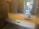 Bathroom vanity with a large mirror, sink, and tile flooring at 7900 S Orange Blossom Trl # 2136, Orlando, FL 32809
