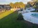 View of the pool area, enhanced with palm trees, a flag, and lush greenery at 7900 S Orange Blossom Trl # 2136, Orlando, FL 32809