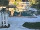 View of the leisure pool surrounded by a white fence at 7900 S Orange Blossom Trl # 2136, Orlando, FL 32809