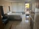 Inviting studio with plush bed, sofa, and view, designed for comfortable, modern living at 7900 S Orange Blossom Trl # 2136, Orlando, FL 32809