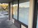 Close up shot of a unit exterior with a door and window, view of the pool in the distance at 7900 S Orange Blossom Trl # 2136, Orlando, FL 32809