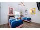 Cozy bedroom with two beds, ceiling fan and hardwood floors at 8112 Princess Palm Ln, Kissimmee, FL 34747