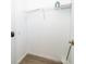 Small closet with wire rack shelving and laminate floors at 8112 Princess Palm Ln, Kissimmee, FL 34747
