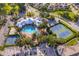 Aerial shot of the community pool, tennis courts, and playground at 8112 Princess Palm Ln, Kissimmee, FL 34747
