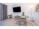 Dining area with clear glass table set and mounted television at 8112 Princess Palm Ln, Kissimmee, FL 34747