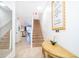 Inviting entryway with staircase, neutral tile floors and decor at 8112 Princess Palm Ln, Kissimmee, FL 34747
