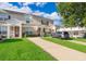 Inviting townhome with well-manicured lawn and private driveways at 8112 Princess Palm Ln, Kissimmee, FL 34747