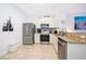 Bright kitchen featuring stainless steel appliances, tile backsplash, and tile floors at 8112 Princess Palm Ln, Kissimmee, FL 34747