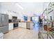 Open kitchen boasts stainless steel appliances, granite countertops, and tiled flooring at 8112 Princess Palm Ln, Kissimmee, FL 34747