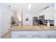 Kitchen bar with granite countertop and stainless steel appliances, leading into home at 8112 Princess Palm Ln, Kissimmee, FL 34747