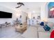 Comfortable living room with view into dining area and kitchen at 8112 Princess Palm Ln, Kissimmee, FL 34747