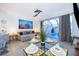Cozy living room with sliding glass doors to a pool area and view at 8112 Princess Palm Ln, Kissimmee, FL 34747