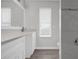 Bright bathroom featuring single sink vanity and updated shower at 10957 Norcross Cir, Orlando, FL 32825