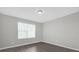 Bedroom featuring a large window and light color scheme at 10957 Norcross Cir, Orlando, FL 32825