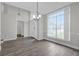 Bright and spacious dining room featuring hardwood floors and a large window at 10957 Norcross Cir, Orlando, FL 32825