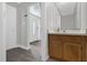 Foyer featuring updated vanity with solid surface counters and decorative mirror at 10957 Norcross Cir, Orlando, FL 32825