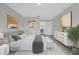 Stylishly decorated main bedroom featuring a plush bed and artwork and leads to ensuite bathroom at 10957 Norcross Cir, Orlando, FL 32825