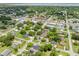 A lovely aerial view of the property nestled in a quiet neighborhood with mature trees, offering both privacy and convenience at 1501 Delaware Ave, St Cloud, FL 34769