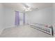 Cozy bedroom featuring a toddler bed, tile floor, and a three drawer dresser at 1501 Delaware Ave, St Cloud, FL 34769