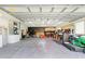 Spacious garage featuring ample workspace, shelving, and tool storage for various projects at 1501 Delaware Ave, St Cloud, FL 34769